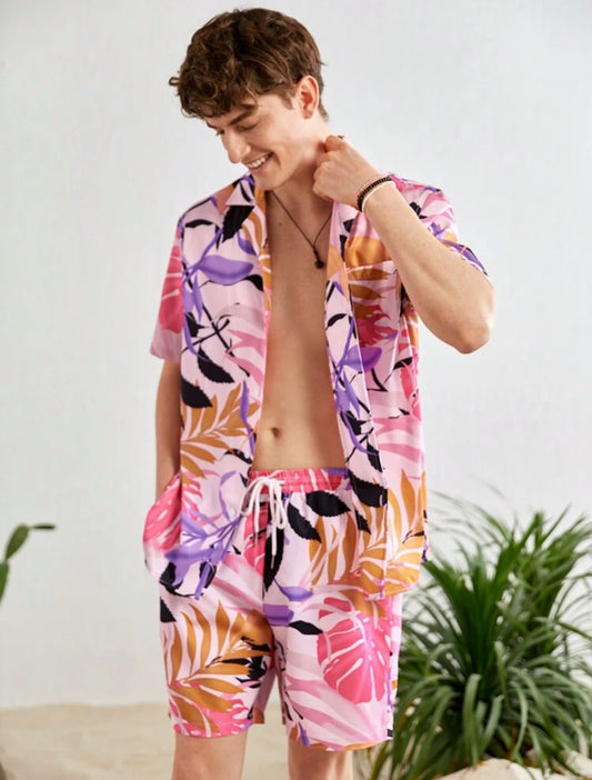 Men’s casual two-piece set featuring a short-sleeve shirt and matching shorts with a vibrant tropical leaf print. Made from lightweight and breathable fabric, perfect for summer, beach trips, or relaxed everyday wear.